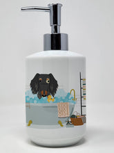 Load image into Gallery viewer, Dapple Wire Haired Dachshund in Bathtub Ceramic Soap Dispenser
