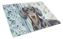 Load image into Gallery viewer, Black and Tan Dachshund Coastal Sea Glass Glass Cutting Board