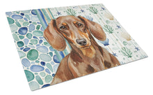 Load image into Gallery viewer, Chocolate and Tan Dachshund Coastal Sea Glass Glass Cutting Board