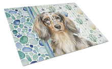 Load image into Gallery viewer, Longhaired Dapple Dachshund Coastal Sea Glass Glass Cutting Board