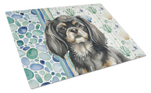 Load image into Gallery viewer, Black and Tan Tibetan Spaniel Coastal Sea Glass Glass Cutting Board