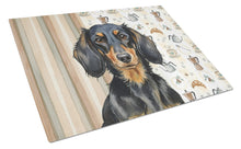 Load image into Gallery viewer, Longhaired Black and Tan Dachshund Coffee Bar Glass Cutting Board