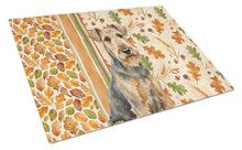 Load image into Gallery viewer, Grizzle Airedale Terrier Heirloom Fall Glass Cutting Board
