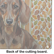 Load image into Gallery viewer, Chocolate and Tan Dachshund Heirloom Fall Glass Cutting Board