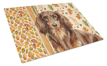 Load image into Gallery viewer, Longhaired Chocolate and Tan Dachshund Heirloom Fall Glass Cutting Board