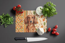 Load image into Gallery viewer, Longhaired Red Dachshund Heirloom Fall Glass Cutting Board