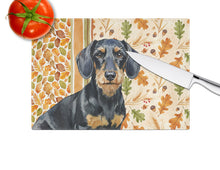 Load image into Gallery viewer, Wirehaired Black and Tan Dachshund Heirloom Fall Glass Cutting Board
