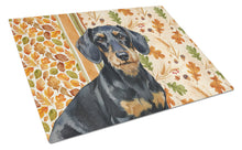 Load image into Gallery viewer, Wirehaired Black and Tan Dachshund Heirloom Fall Glass Cutting Board