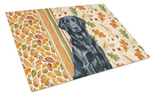 Load image into Gallery viewer, Black Flat-Coated Retriever Heirloom Fall Glass Cutting Board