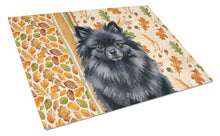 Load image into Gallery viewer, Black Pomeranian Heirloom Fall Glass Cutting Board