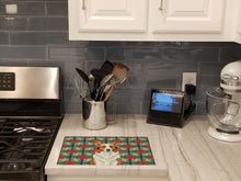 Load image into Gallery viewer, Red and White Border Collie Christmas PoinsettIas Glass Cutting Board