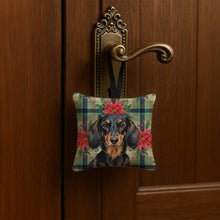 Load image into Gallery viewer, Longhaired Black and Tan Dachshund Christmas PoinsettIas Hanging Square Fabric Ornament 3.5 x 3.5