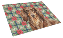 Load image into Gallery viewer, Longhaired Chocolate and Tan Dachshund Christmas PoinsettIas Glass Cutting Board