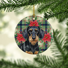 Load image into Gallery viewer, Wirehaired Black and Tan Dachshund Christmas PoinsettIas Ceramic Ornament