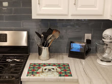 Load image into Gallery viewer, Cream Pekingese Christmas PoinsettIas Glass Cutting Board