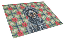 Load image into Gallery viewer, Black Portuguese Water Dog Christmas PoinsettIas Glass Cutting Board