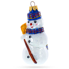 Load image into Gallery viewer, Snowman Wearing Blue Hat and Plaid Scarf with Broom Glass Christmas Ornament