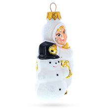 Load image into Gallery viewer, Toddler Hugging Snowman Glass Christmas Ornament