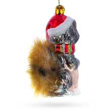 Load image into Gallery viewer, Raccoon Holding Squirrel Glass Christmas Ornament