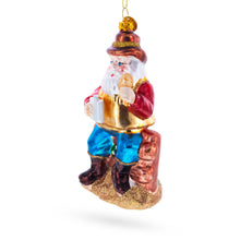 Load image into Gallery viewer, Cowboy Santa with Drink and Drumstick Glass Christmas Ornament