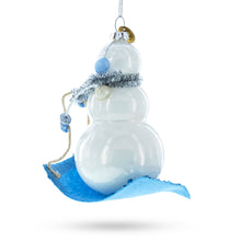 Load image into Gallery viewer, Snowman Riding a Sled Glass Christmas Ornament