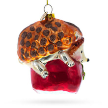 Load image into Gallery viewer, Hedgehog Savoring a Red Apple Glass Christmas Ornament
