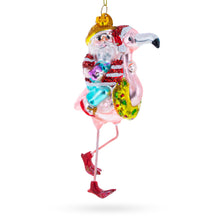 Load image into Gallery viewer, Santa Riding a Pink Flamingo Glass Christmas Ornament