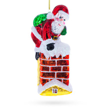 Load image into Gallery viewer, Santa Going Down the Chimney Glass Christmas Ornament