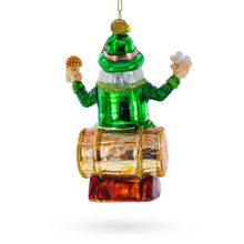 Load image into Gallery viewer, Irish Santa Sitting on a Whiskey Barrel Glass Christmas Ornament