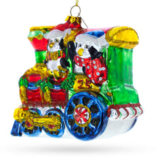 Load image into Gallery viewer, Playful Penguins Riding Train Glass Christmas Ornament