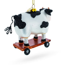 Load image into Gallery viewer, Spotted Cow Ice Skating Glass Christmas Ornament