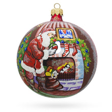 Load image into Gallery viewer, Santa Filling Stockings by a Cozy Fireplace Glass Ball Christmas Ornament 4 Inches