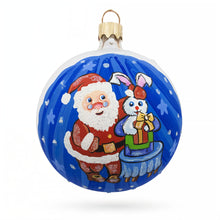Load image into Gallery viewer, Santa's Magical Rabbit Trick Glass Ball Christmas Ornament 3.25 Inches