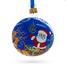 Load image into Gallery viewer, Jolly Santa Riding Sleigh with Reindeer Glass Ball Christmas Ornament 3.25 Inches