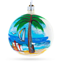 Load image into Gallery viewer, Santa Hat Relaxing at Beach Glass Ball Christmas Ornament 4 Inches