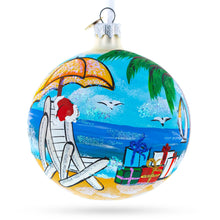 Load image into Gallery viewer, Santa Hat Relaxing at Beach Glass Ball Christmas Ornament 4 Inches