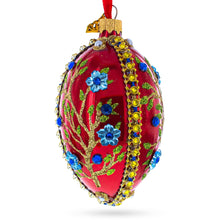 Load image into Gallery viewer, Blue Bejeweled Flowers on Red Glass Egg Ornament 4 Inches