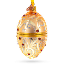Load image into Gallery viewer, Red Jewels on Champagne Swirls Glass Egg Ornament 4 Inches
