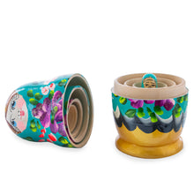 Load image into Gallery viewer, Green Hood with Purple and Orange Flowers Wooden  Nesting Dolls
